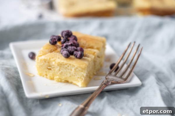 side view of a baked sourdough pancake topped with blueberries