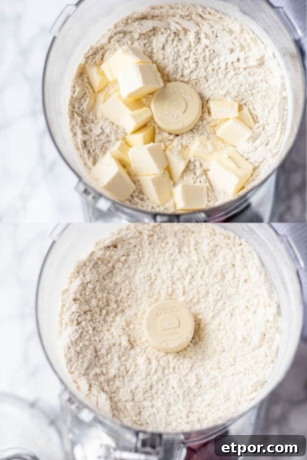 Cold butter chunks being added to a food processor with dry ingredients to make sourdough scone dough.