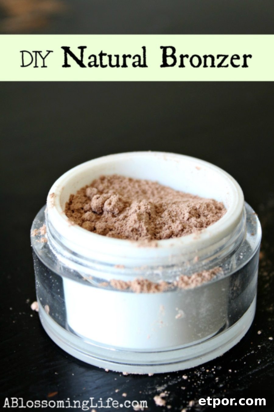 DIY Bronzer in a white and clear container on a black table