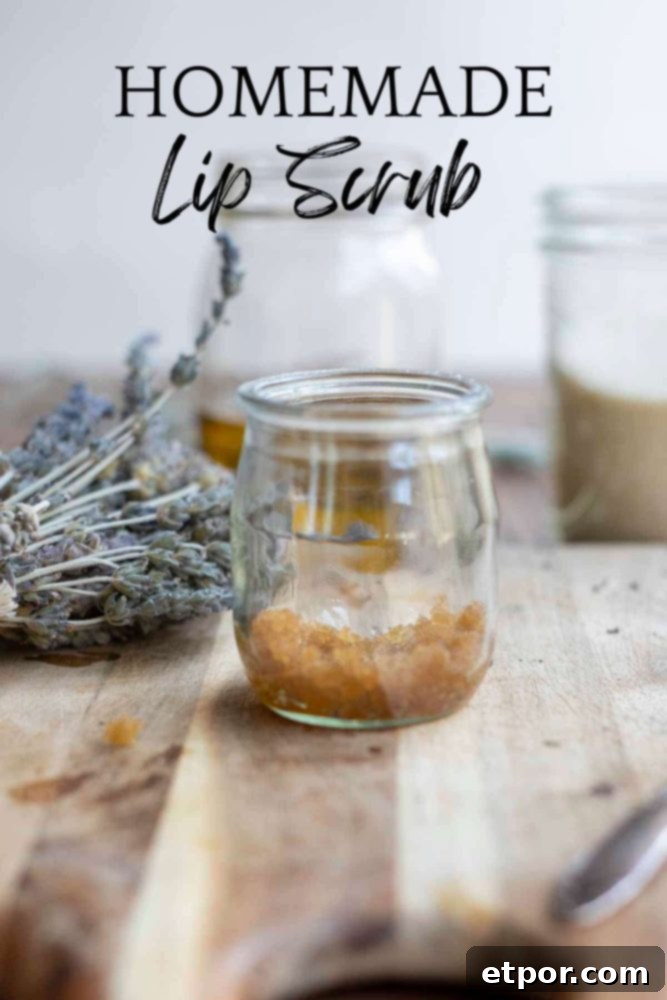 Whip Up Your Own Lip Scrub 2 small glass jar with diy lip scrub made with brown sugar on a wood cutting board with dried lavender in the background