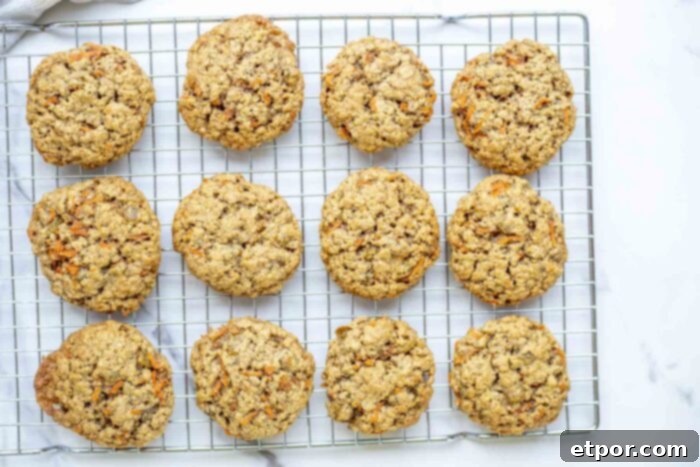 sourdough carrot cake cookies cooling on a rack.