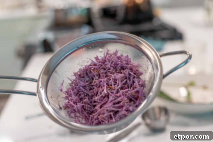 washed lilacs in a fine mesh strainer.