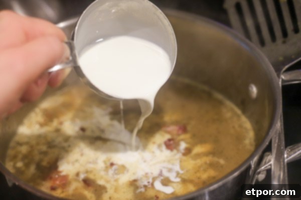 adding cream to baked potato soup 