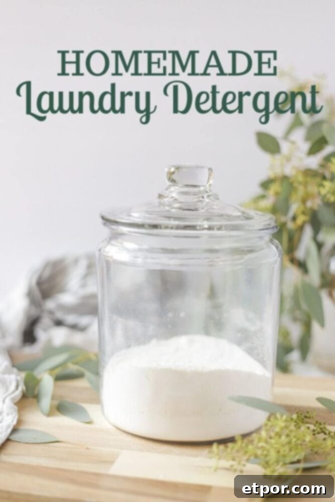 natural homemade laundry detergent on a wood counter with eucalyptus leaves spread around