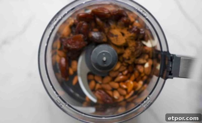 dates, almonds, spices, salt, and oil in a food processor