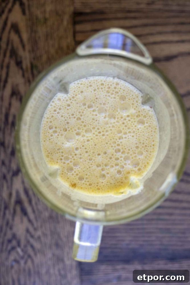 Spiced Pumpkin Pie Bliss Smoothie 9 pumpkin smoothie in a blender blended up