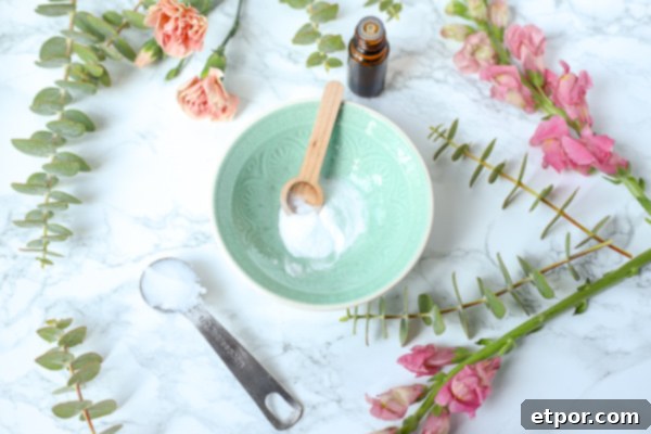 baking soda in a teal bowl with flowers around to make diy face scrub