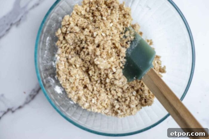 Simple Strawberry Crumble Bliss 5 Oat crumble in a glass bowl.
