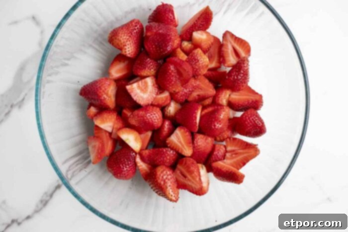 Simple Strawberry Crumble Bliss 6 Cut strawberries in a bowl.