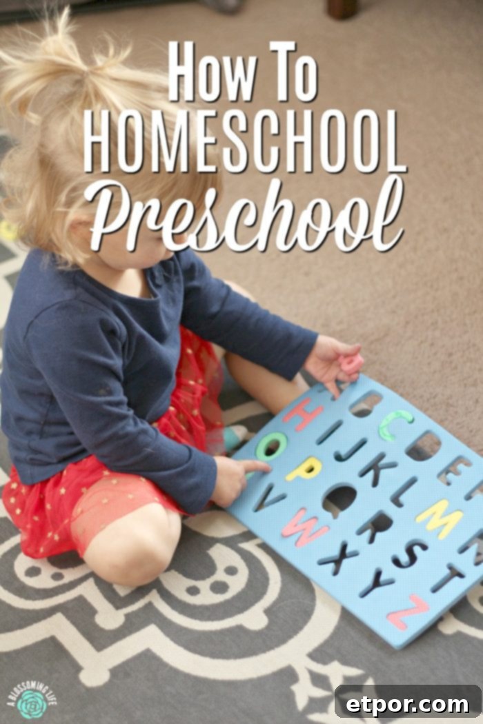 Homeschooling Preschool: Your Step-by-Step Guide 2 A young child happily engaging with a colorful letter mat during a homeschool preschool lesson, highlighting interactive learning