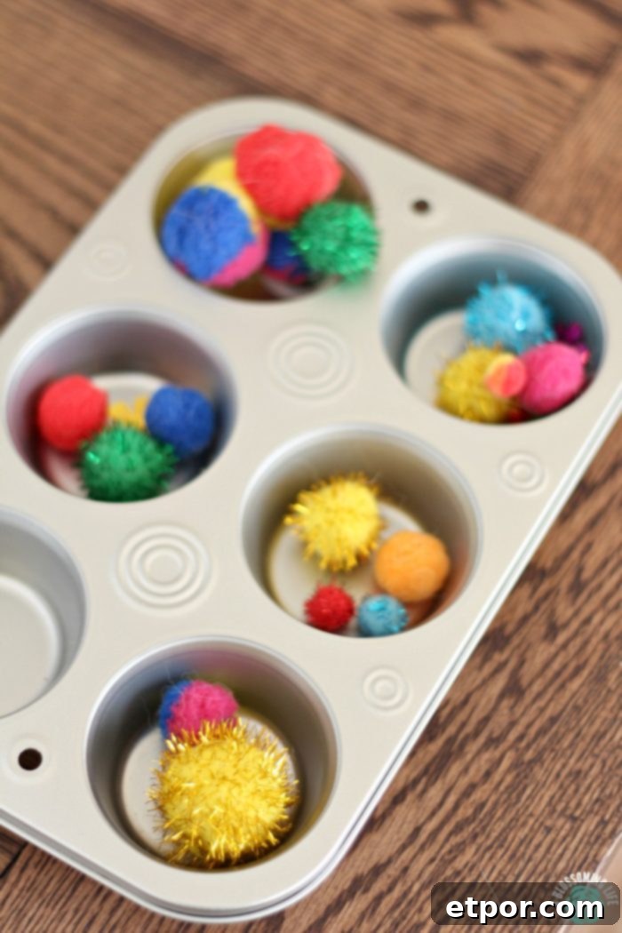 Homeschooling Preschool: Your Step-by-Step Guide 3 Muffin tin with colorful craft balls used for a homeschool preschool sorting lesson, teaching colors and sizes