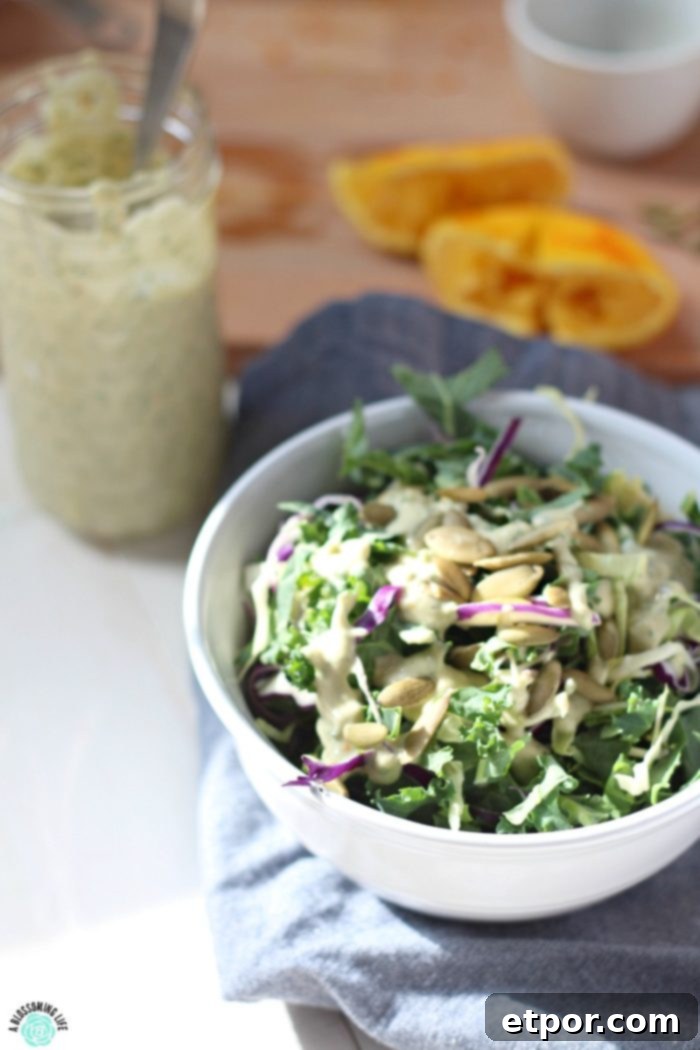 Radiant Orange Goddess Dressing 3 Orange Goddess Dressing over a kale salad with pepitas