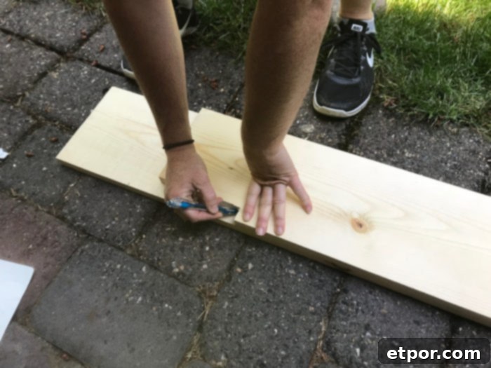 Measuring wood for DIY fireplace mantel to ensure accurate cuts for a custom fit