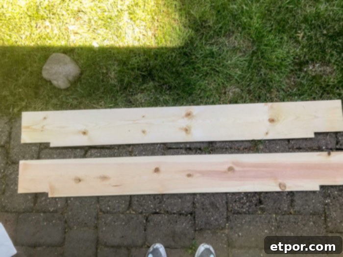 Pieces of carefully cut wood, ready for assembly into a DIY fireplace mantel