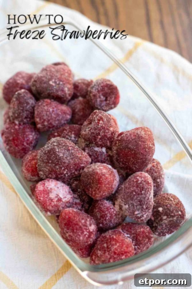 A vibrant close-up of fresh strawberries, perfectly ripe and ready for freezing.