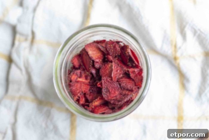 Mastering Homemade Dehydrated Strawberries 11 overhead photo of a jar filled with dried strawberries