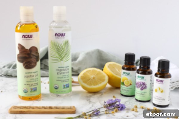 Botanical Detangling Hair Mist 3 NOW essential oils, jojoba oil, and vegetable glycerin displayed on a wooden surface.