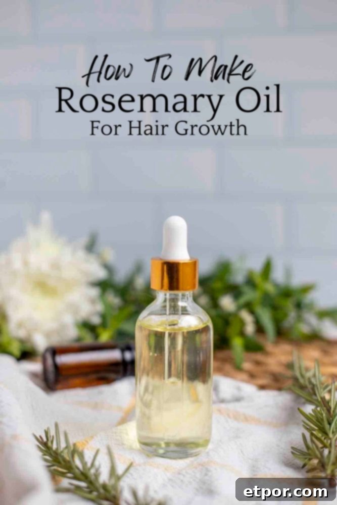 Boost Hair Growth with Homemade Rosemary Oil 2 A glass jar with a dropper with rosemary oil on a white and yellow towel with an essential oil bottle and flowers in the background. The jar is surrounded by fresh rosemary