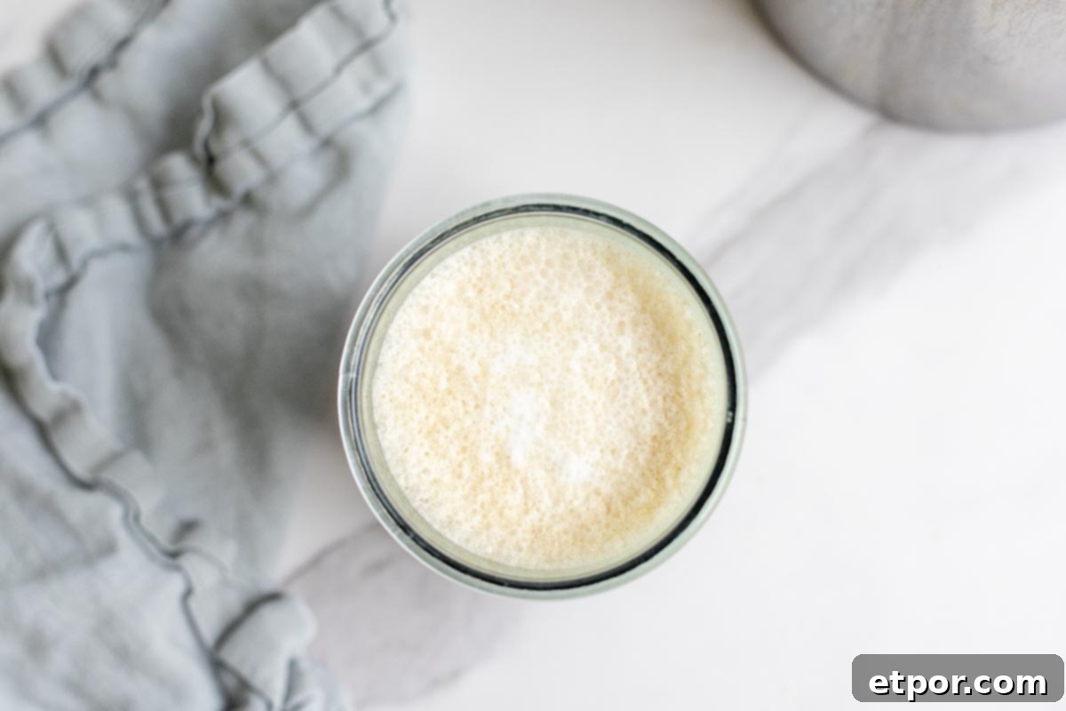 overhead photo of cold foam in a glass jar.