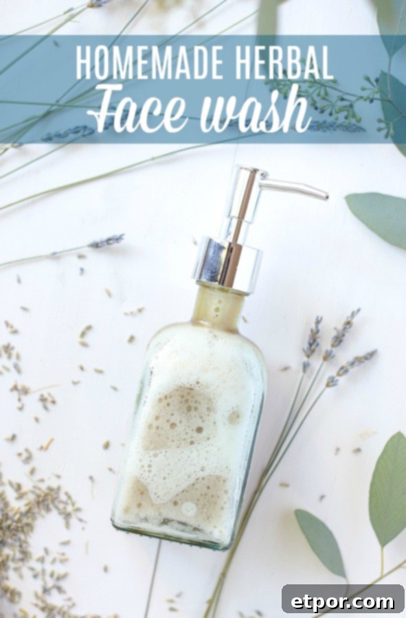 Homemade face wash in a glass soap pump with dried lavender around the DIY face wash, emphasizing natural ingredients.