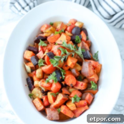 Rustic Roasted Root Vegetables 6 roasted root vegetables in a white bowl with a black and white striped towel behind it