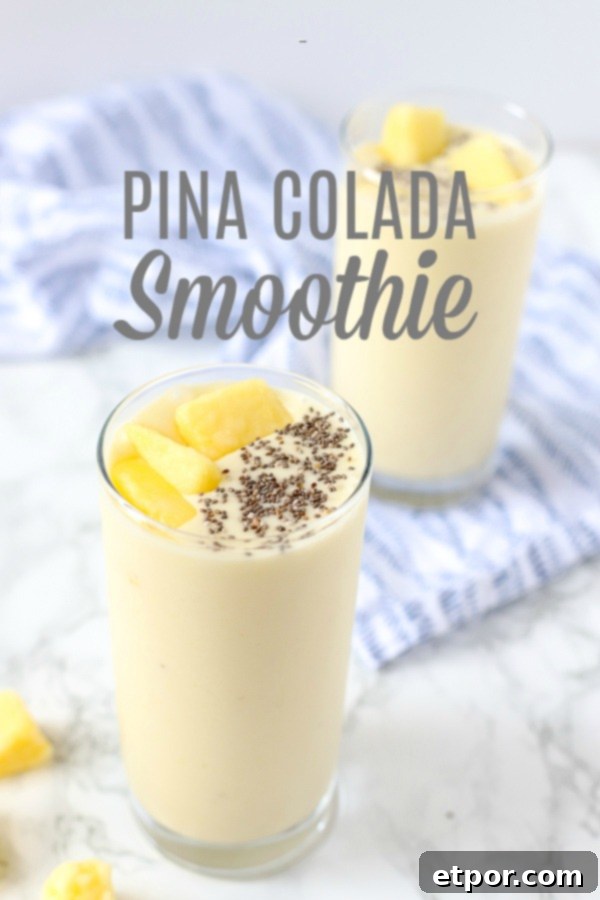Guilt-Free Tropical Pina Colada Delight 2 pina colada smoothie recipe in two glass cups topped with chia seeds and pineapples and placed on a blue and white napkin.