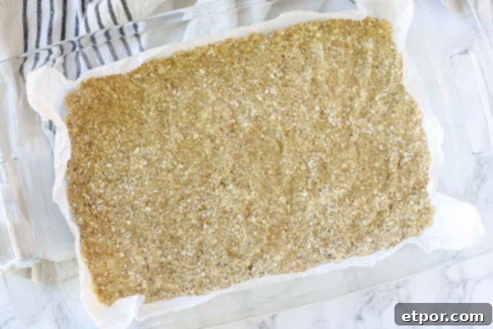 oatmeal crust in a glass baking dish on top of white towel
