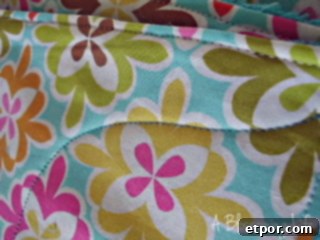 Topstitching the edges and sewing a wiggly line through the middle of the unpaper towel for stability