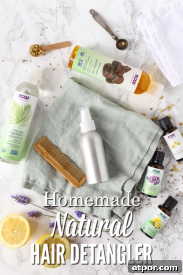 Homemade natural hair detangler spray in a sleek metal bottle, surrounded by fresh ingredients like lemons, chamomile, and lavender essential oils, highlighting the natural components of the DIY hair care solution.