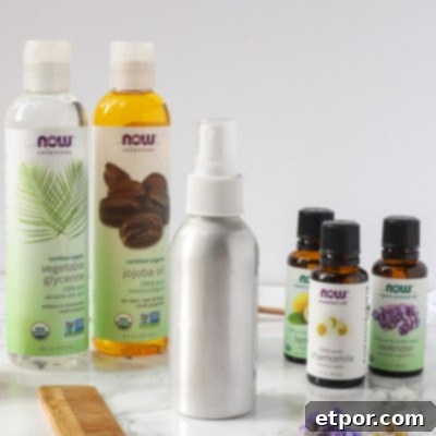 Homemade detangler spray in a metal spray bottle, ready for use.