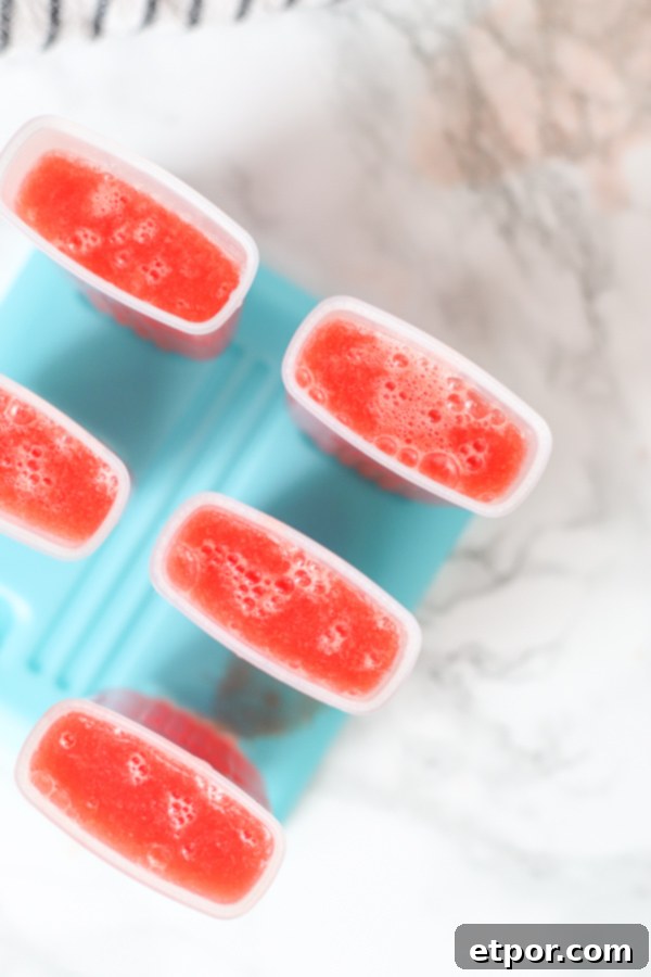 watermelon mixture poured into a popsicle mold