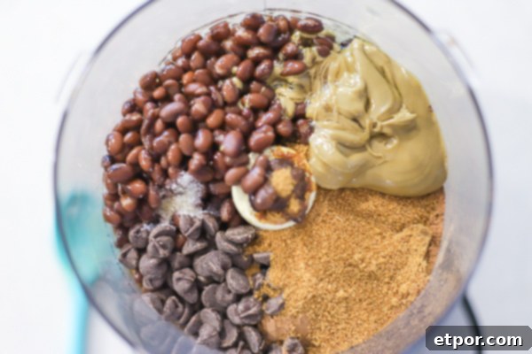 ingredients to make chocolate hummus in a food processor