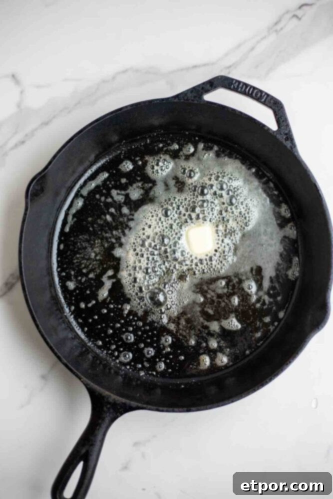 Butter in a cast iron skillet.