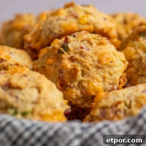 Ham and cheese breakfast biscuits in a basket.